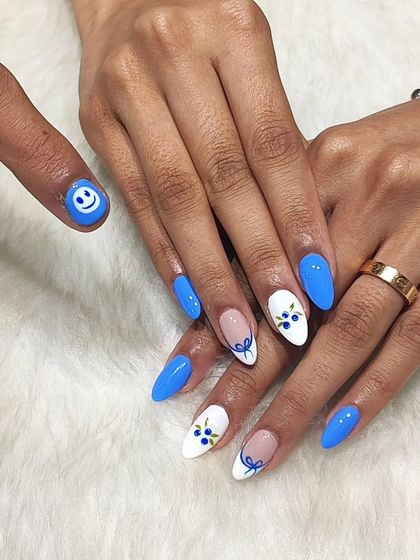 Couple goals. I created this matching set for a couple, with a fun smiley face on his thumb to coordinate with her cute blueberry-themed nails.