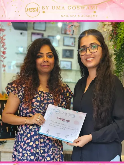 Harman proudly holding her certificate after completing her course. She is now ready to take her skills back to Delhi.