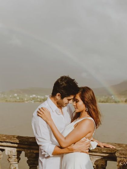 A magical moment captured as a rainbow appears over the lake behind the embracing couple. Sometimes nature gives us the most beautiful, unexpected backdrops for a pre-wedding shoot.