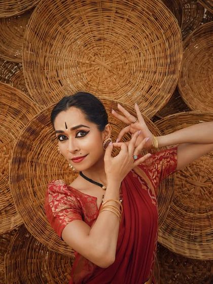 A close-up from an artistic collaboration. The makeup is adapted to suit the rustic theme, with earthy tones that harmonize with the background while still maintaining the sharp, defined eyes of a classical dancer.