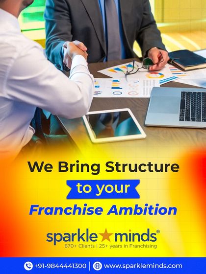 We bring structure to your franchise ambition. This image of a professional handshake over business plans signifies our role in shaping your expansion goals into a profitable and organized reality.