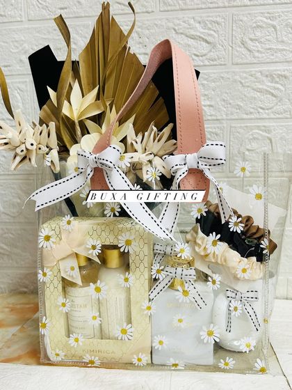 The all-white luxury hamper, beautifully arranged in a transparent floral handbag.