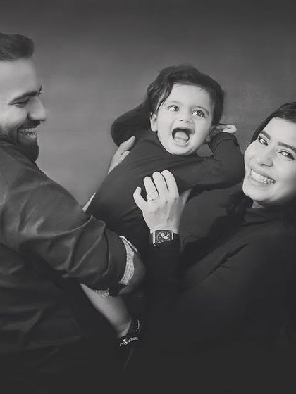 Capturing the joy and laughter of family life in classic black and white. These candid moments are often the most precious.