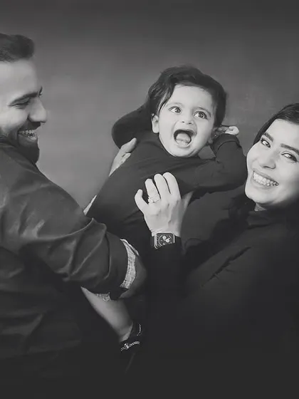 Capturing the joy and laughter of family life in classic black and white. These candid moments are often the most precious.