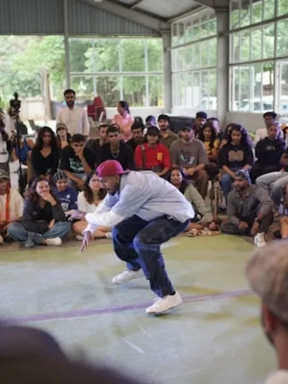 A house dancer laying down some killer moves during the 1v1 battle at Spectra 2025. The house category was full of energy and impressive footwork.