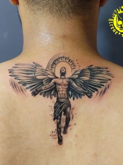 A stunning back piece of Icarus, the winged figure from Greek mythology, ascending towards the sun. This tattoo symbolizes ambition, freedom, and the pursuit of dreams.