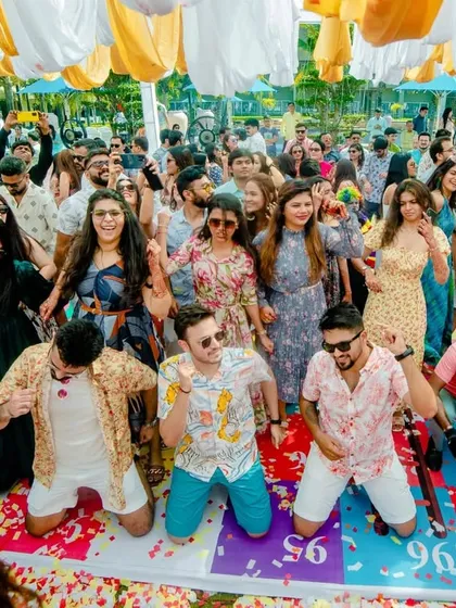 Guests playing a giant game of snakes and ladders on the dance floor. We incorporate fun games to keep everyone entertained.