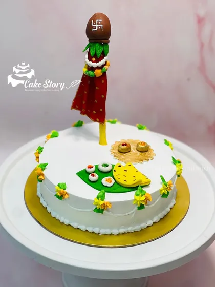Celebrating Gudi Padwa and the Marathi new year with a special themed cake. It features an edible Gudi, along with other traditional elements, making it a sweet way to welcome the new year.