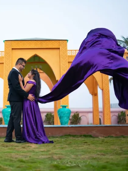 Making a grand statement with a pop of color. The flying trail of this purple gown adds so much life and energy to the couple's pre-wedding photos at this beautiful location.