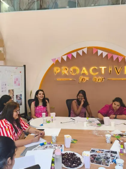 Our therapists facilitating a discussion during the vision board workshop. This isn't about toxic positivity; it's about tackling what really holds women back and turning it into an action plan.