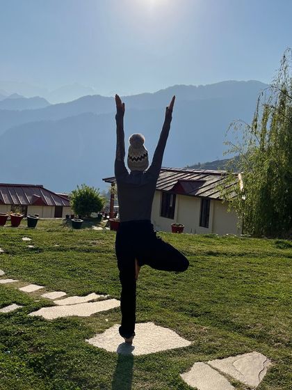 Finding stability in Vrikshasana, or tree pose, with the morning sun warming my back. Practicing this balancing pose outdoors helps me feel rooted to the earth while reaching for the sky.