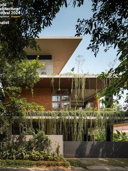 The home's exterior is a composition of clean lines, natural materials, and lush vegetation. The design aims to create a private oasis that feels both modern and timeless.
