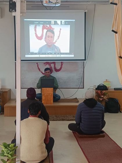 Here you can see one of our online participants projected for the class to see. This interactive setup in our workshops fosters a sense of community between our online and offline students.