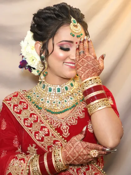 A candid, happy moment. This bride's look is all about radiance, with shimmery eyeshadow and a joyful smile.