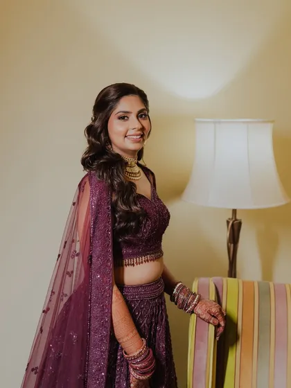 A beautiful profile of Kajol, ready for her Sangeet. The soft curls and glowing skin create a romantic and elegant party look.