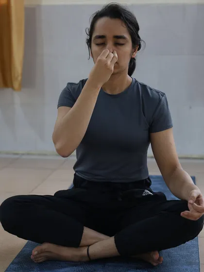 A student practices Anuloma Viloma, alternate nostril breathing. This pranayama technique is excellent for calming the mind and balancing the nervous system.