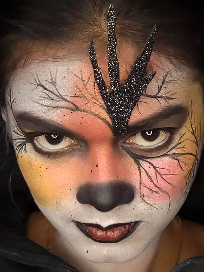 A close-up of my gothic fantasy creation. This look features intricate, hand-painted branches, a warm-to-cool color gradient on the skin, and dramatic white contact lenses to complete the eerie, enchanted forest vibe.