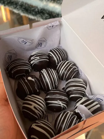 A box of my classic chocolate truffles, decorated with white chocolate drizzle. This is a simple, elegant, and always delicious gift for any occasion during the holiday season.