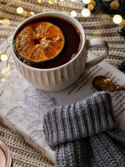 My plan for a cold day: curl up, be cozy, and sip tea. This image captures that feeling perfectly, with a warm cup of tea resting on a book, ready for a quiet afternoon.