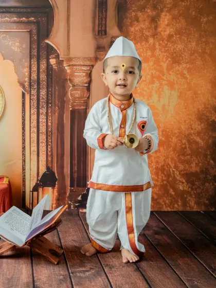 I offer unique cultural themes like this 'Chota Varkari' shoot. This portrait highlights the beautiful traditional attire and props, creating a meaningful and timeless image that celebrates Maharashtrian heritage.