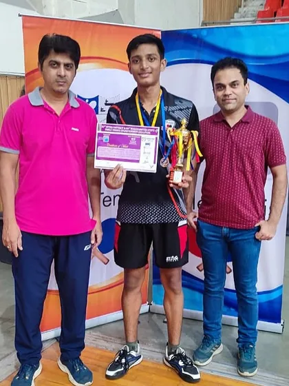 Johan Cheriparambil with his coaches after securing a silver medal in the U-15 category at the Maharashtra State Championship, a result of his consistency and bold play.