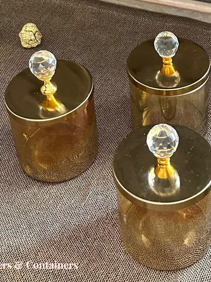 A set of three glass jars with crystal-topped wooden lids. These are perfect for storing dry fruits or snacks while keeping your pantry stylish.