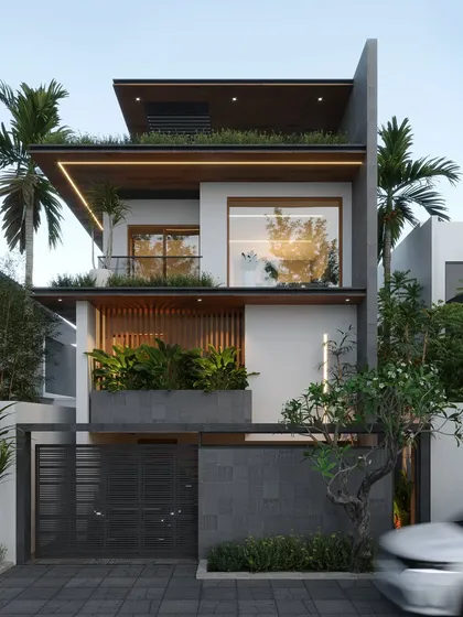 Designed for a narrow plot in Bangalore, this vertical home maximizes space without sacrificing style. The facade incorporates planters and green spaces at multiple levels, bringing nature into a dense urban environment.