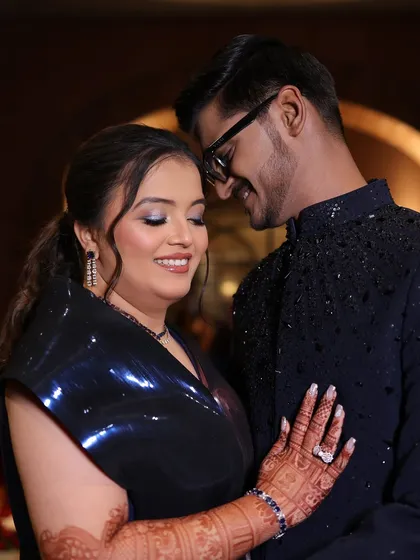 A sweet, romantic pose. Her makeup looks flawless up close, designed to last through a night of dancing and celebration.