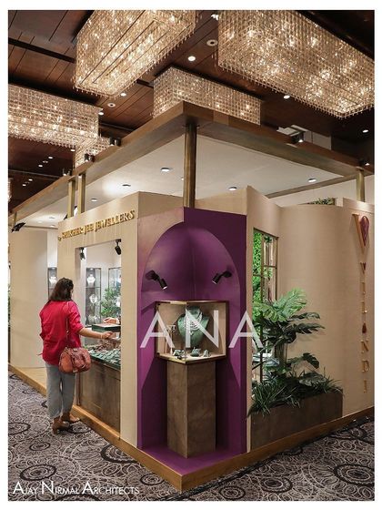 A visitor interacting with the corner display of the Villandi '22 stall. This feature was designed to be an attention-grabbing element that draws people in from the main aisle.