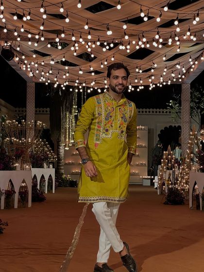 A stylish pose in my ethnic wear. My fashion sense is a mix of traditional and modern, much like my hosting style.