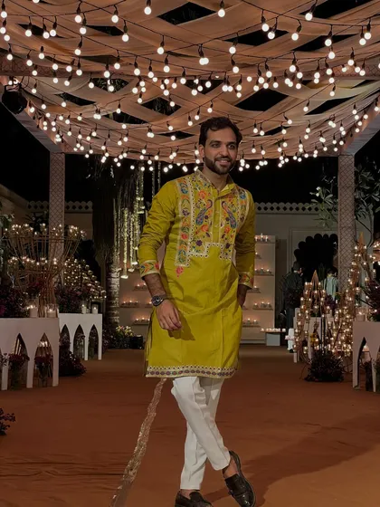 A stylish pose in my ethnic wear. My fashion sense is a mix of traditional and modern, much like my hosting style.