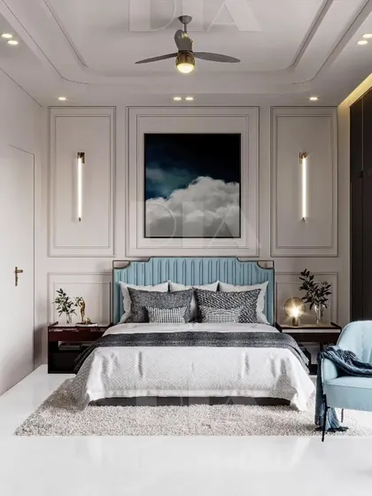 In this contemporary bedroom, I used classic wall molding and a serene blue color palette to create a sense of calm luxury. The vertical sconces and full-height built-in wardrobes add a modern, functional touch to the elegant design.