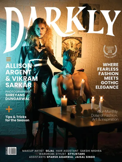The cover for Darkly Magazine, featuring a gothic-inspired narrative. This shot combines two models in a dramatic pose, lit to create a sense of dark elegance and mystery, perfect for a special edition on fearless fashion.