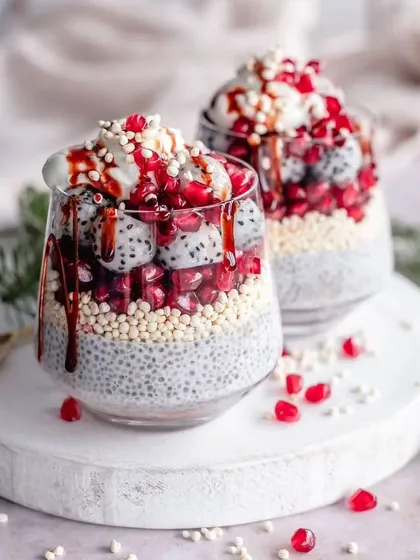 A healthy and beautiful dessert option. Vanilla chia pudding layered with puffed quinoa, dragon fruit, and pomegranate seeds.