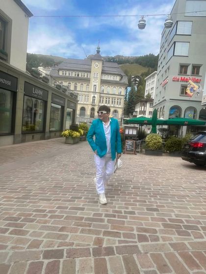 Capturing the European street style vibe in St. Moritz. The cobblestone streets and historic buildings create a timeless atmosphere.