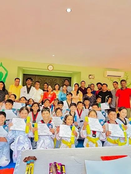 The joy and pride on the faces of students and parents after a belt exam ceremony.