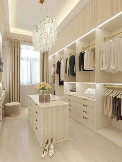 This angle highlights the efficient organization of the cream-colored closet, with dedicated sections for hanging clothes, folded items, and accessories.