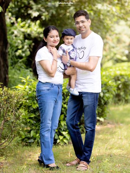 A full-length portrait of a family enjoying a day in the park. Our outdoor sessions in the Delhi-NCR area are perfect for relaxed and natural family photos.