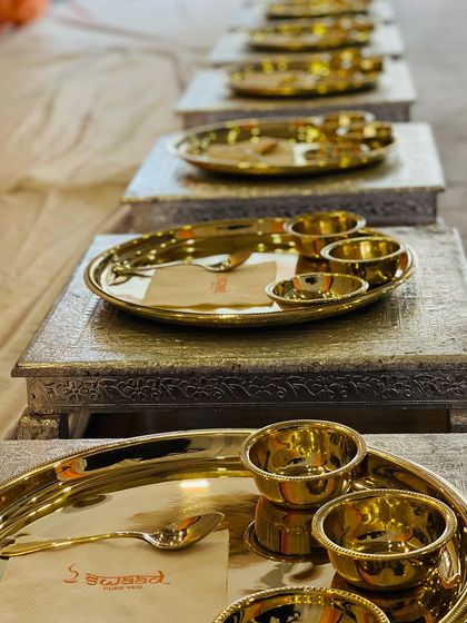 Every detail matters. The Royal Thali is placed on an ornate silver chowki, elevating the presentation and making each guest feel like royalty.