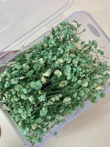 This mint green shade is so fresh and modern. It looks beautiful woven into a soft, romantic braid.