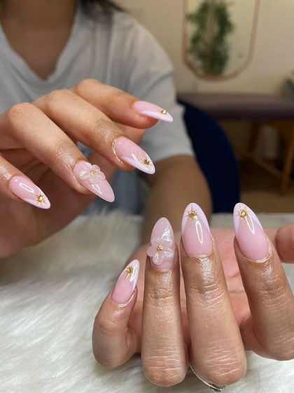 Pink and pretty! This set features a soft pink base with hand-sculpted flexi gel flowers and tiny gold stud embellishments.