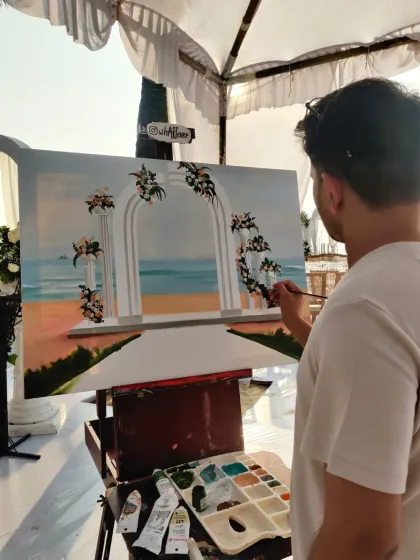 Vivek adding the final details to the beachside scenery for Keerthy and Antony's wedding painting. We always try to capture the venue's unique beauty.