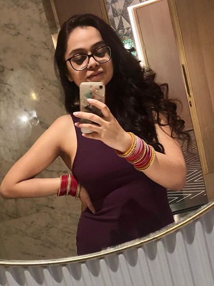 This simple, elegant plum-colored dress is a versatile piece for a travel wardrobe. It can be worn for a nice dinner or a casual evening out, proving that you don't need to pack a lot to have great style options.