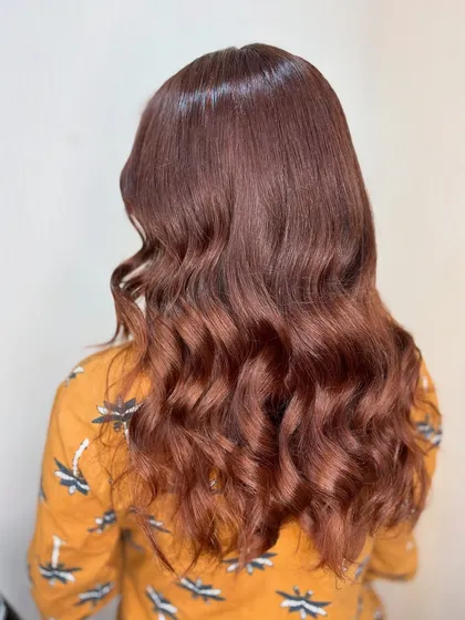 The side profile of this chocolate brown style shows off the soft layers and beautiful shine.