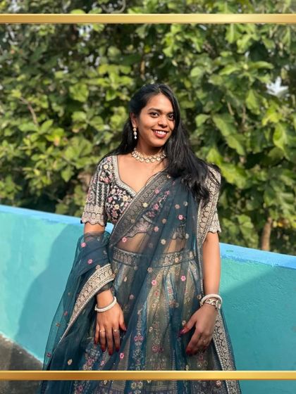A valued client looking beautiful in a dark teal lehenga with floral embroidery. It's an honor to be a part of such joyous occasions.