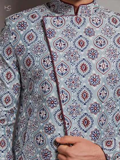 A close-up of a printed jacket, showcasing the intricate pattern and the contrasting piping detail that elevates the traditional look.