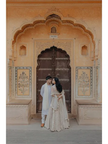 We blend romance with heritage in our pre-wedding shoots. This portrait, set against the royal architecture of Jaipur, captures a quiet, intimate moment that feels both timeless and deeply rooted in culture, showcasing our love for destination photography.