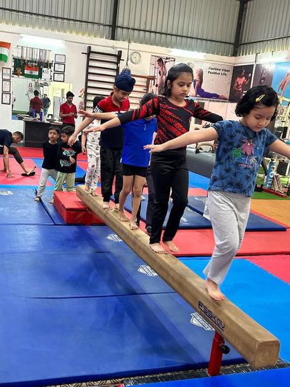 Our youngest gymnasts learn balance and coordination by walking in a line on the low beam. It's a fun way to introduce a challenging apparatus.