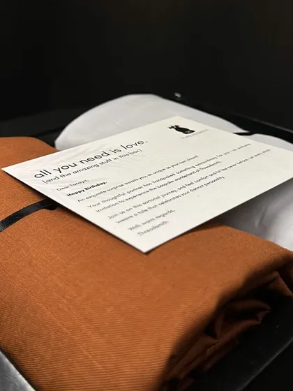 A close-up of our gift set, which includes fabric for a shirt and trouser. It's an invitation to embark on a journey of elevated gifting and mindful opulence.