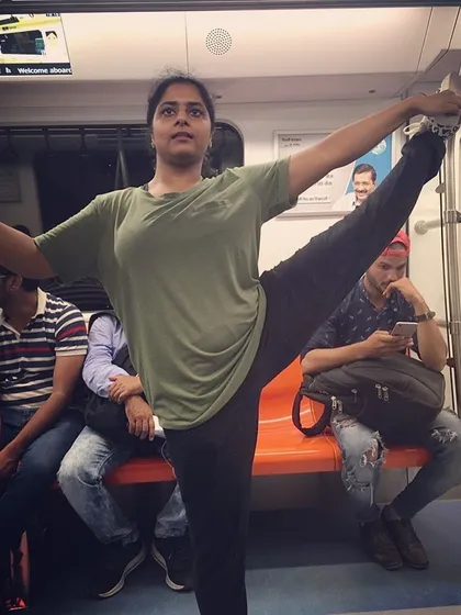 Using a metro ride to work on my leg extension and balance. As a choreographer, maintaining my own physical conditioning is crucial for demonstrating moves clearly and with high energy during rehearsals.